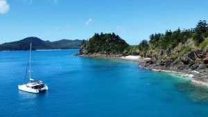 A Portland Roads Sailing the Whitsundays catamaran moored at the stunning Mantaray Bay, Hook Island